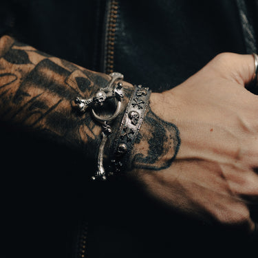 Femurs Bracelet On Model - Gothic Silver Bracelet - Black Feather Design